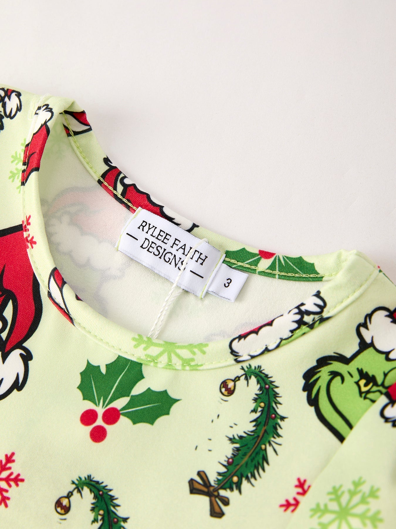 Christmas-themed shirt with 'Rylee and Cru' label on a white background