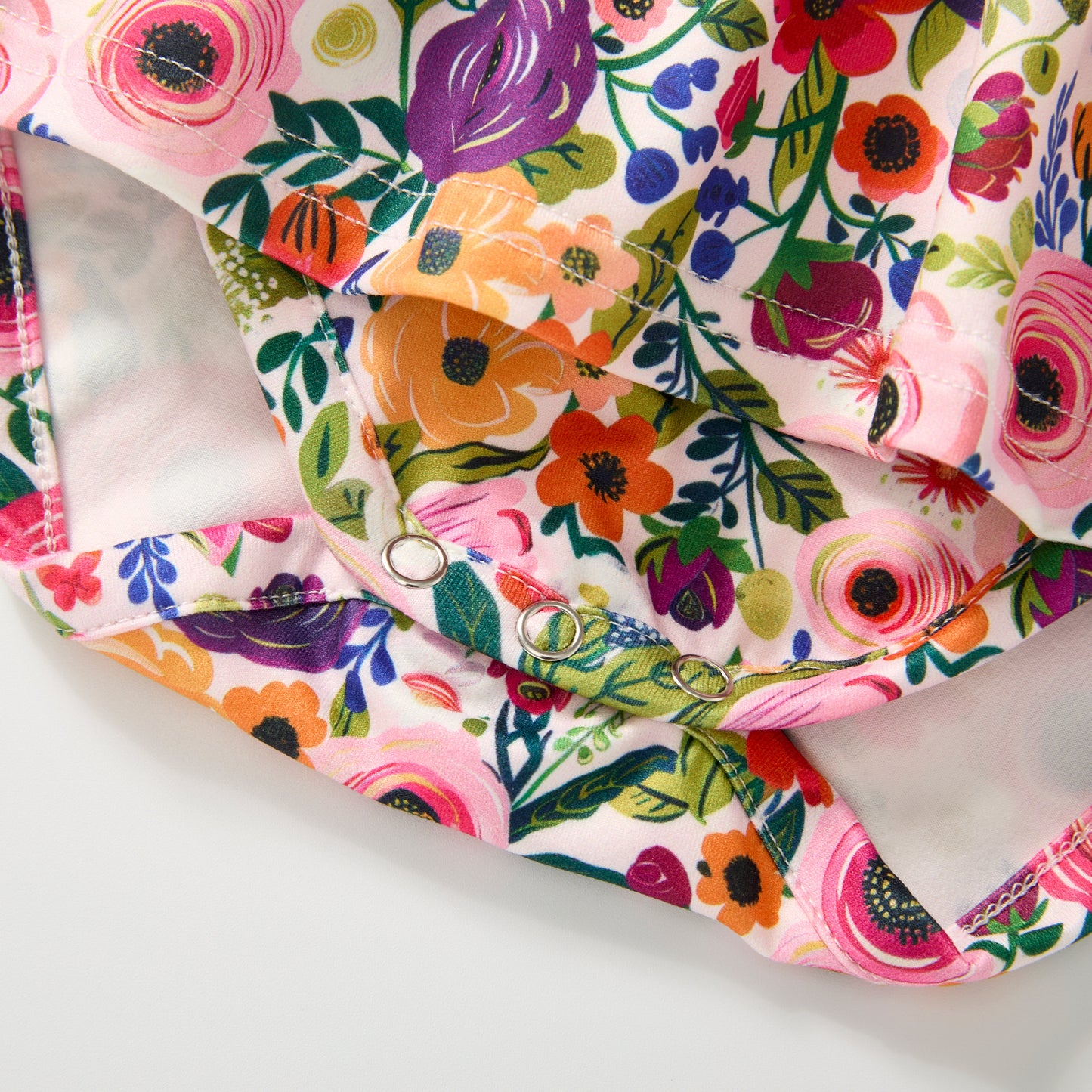 Colorful floral-patterned fabric on a white background