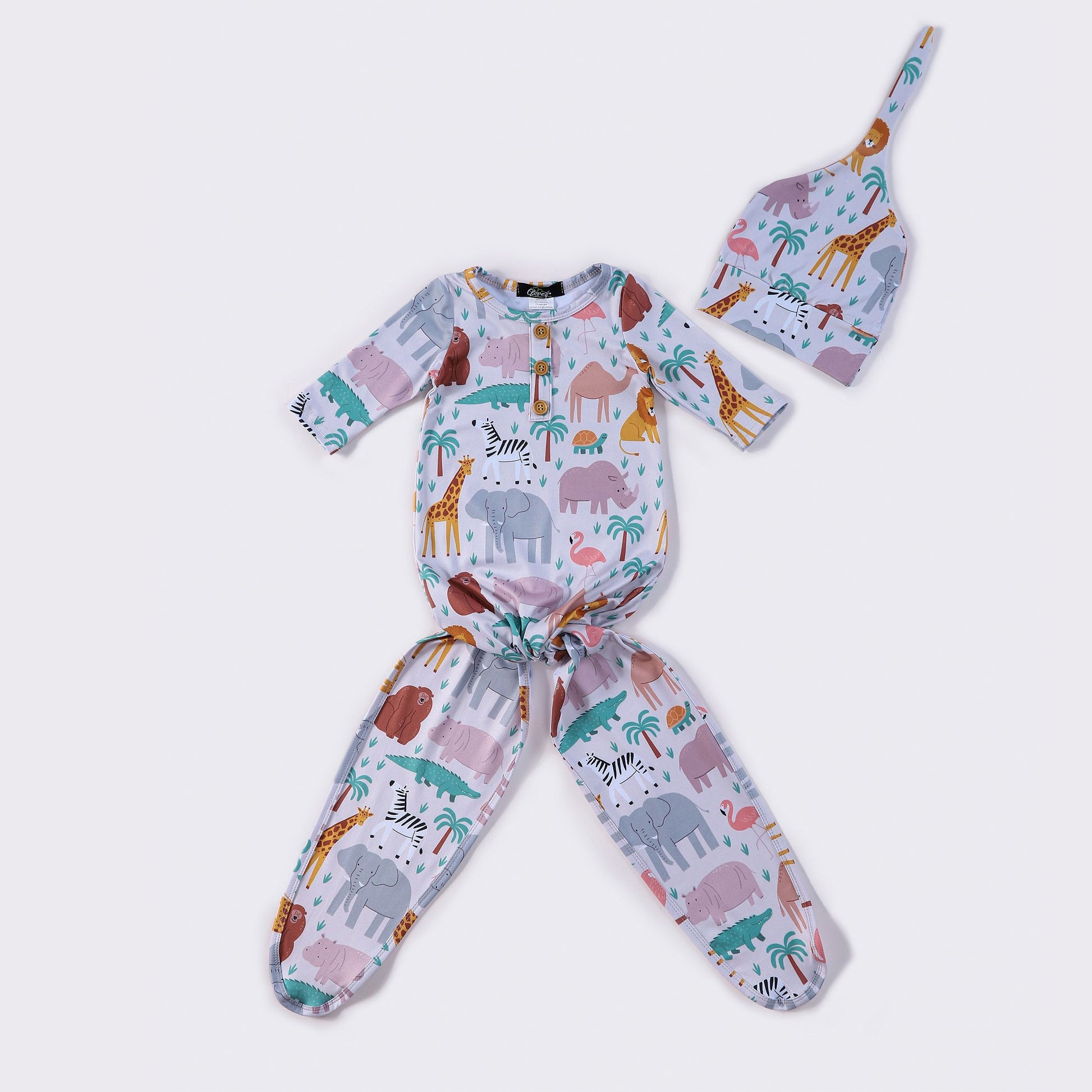 A safari-themed knotted gown with hat for newborns to 6-month-old babies, featuring an animal print on a white background.