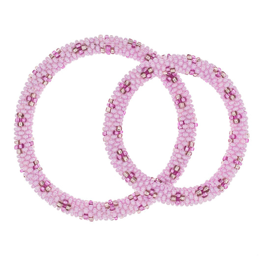 Two pink beaded bracelets on a white background