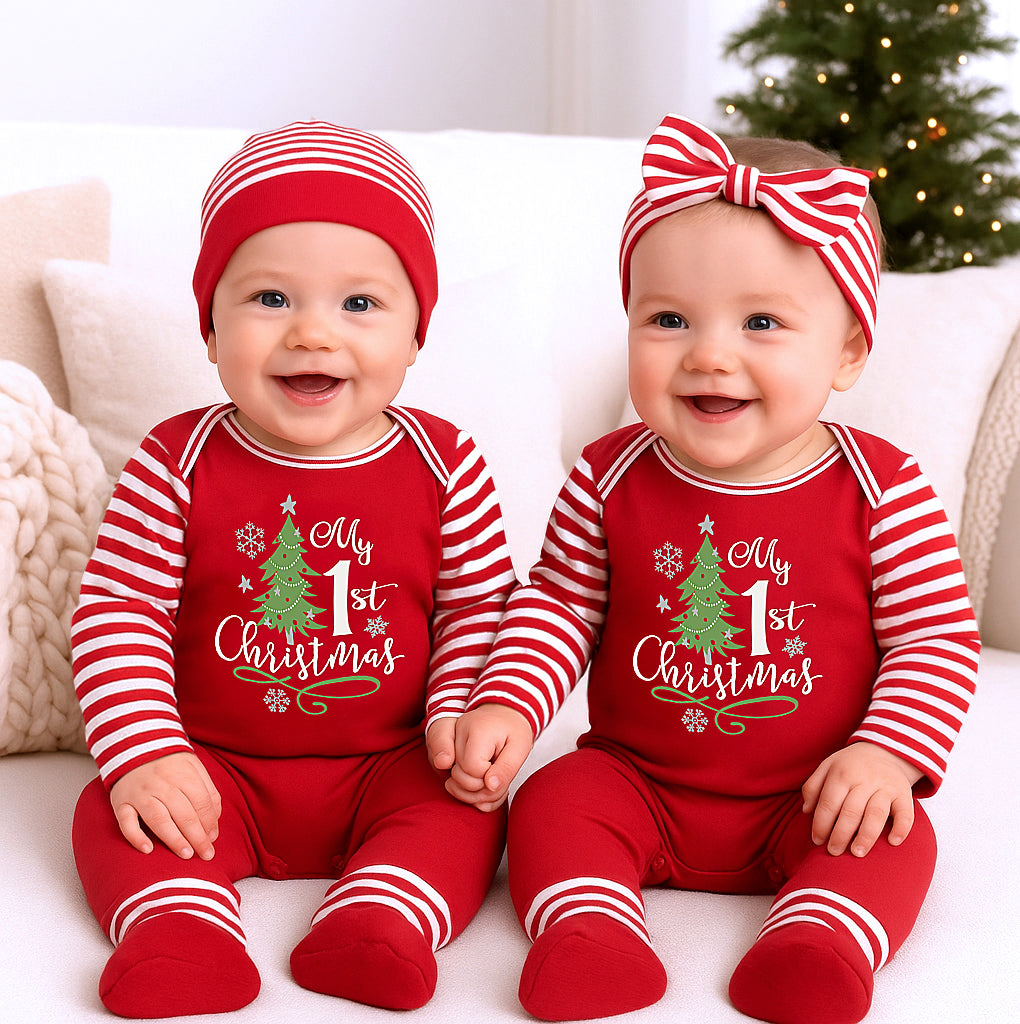 Two babies wearing matching red and white Christmas outfits with 'My 1st Christmas' text.