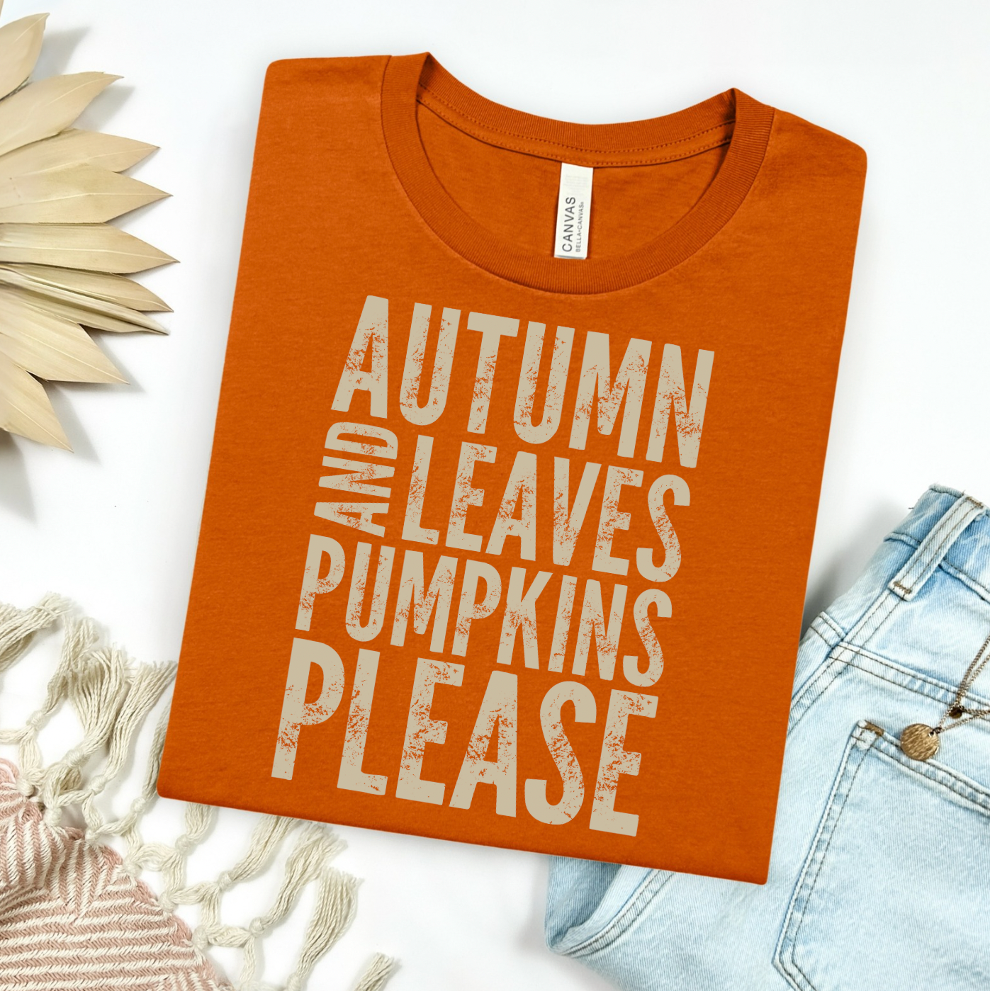 Orange t-shirt with 'Autumn and Leaves Pumpkins Please' text on a white background