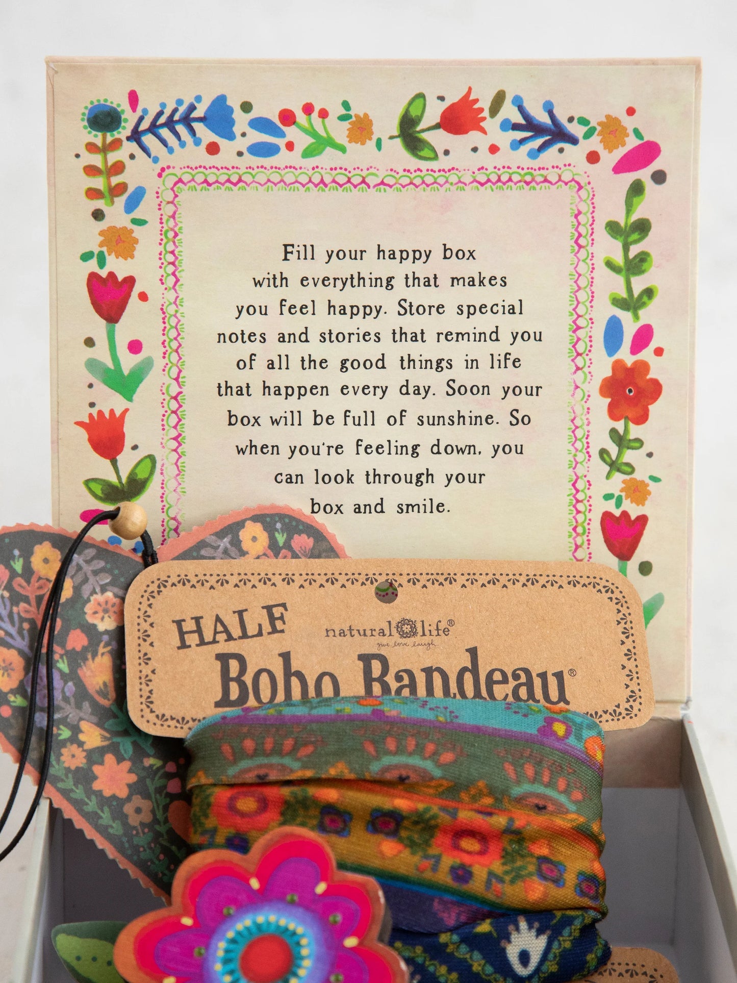 Colorful bohemian-style product with text and decorative elements on a white background