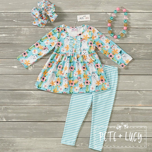 A two-piece baby outfit set with a floral and animal print, consisting of a dress and leggings, accompanied by a headband and a bracelet.