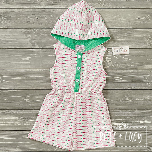 A short-sleeved baby romper with a green hood and a pattern of tennis rackets and balls in pink and green colors.