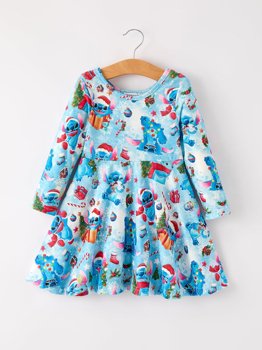 Children's dress with cartoon character print on a hanger against a white background