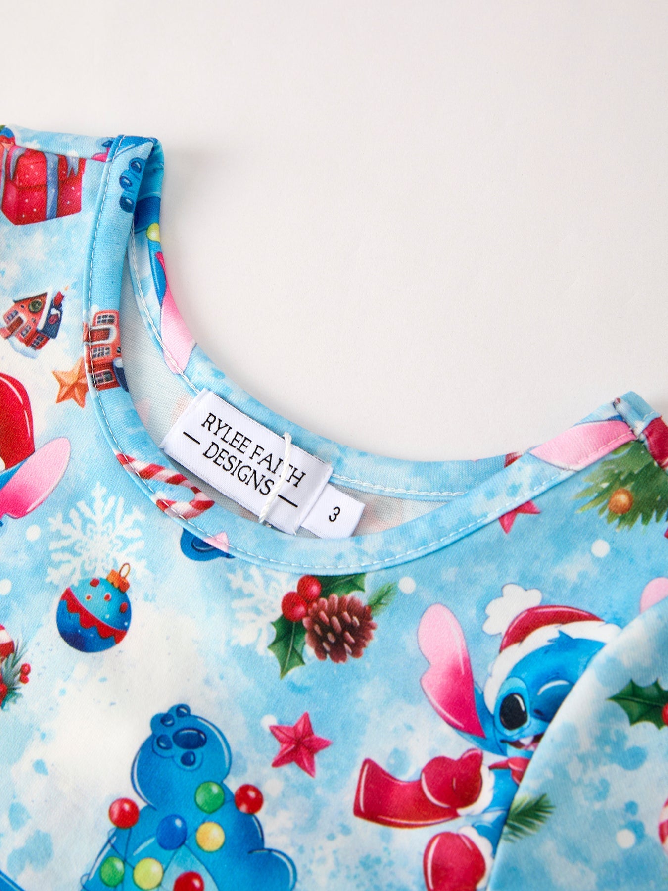 Children's shirt with Christmas-themed design and Rylee and Cru label.