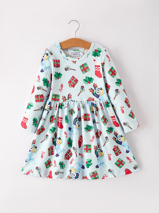 Children's dress with Christmas-themed pattern on a hanger against a white background