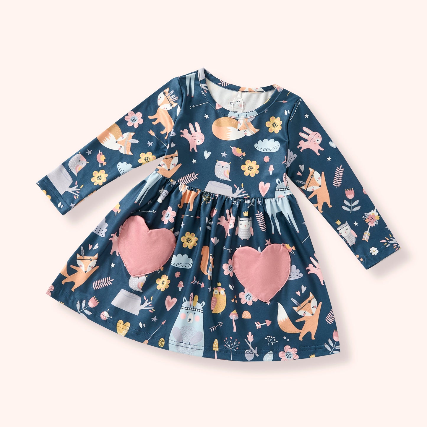 Children's dress with fox and heart pattern on a white background