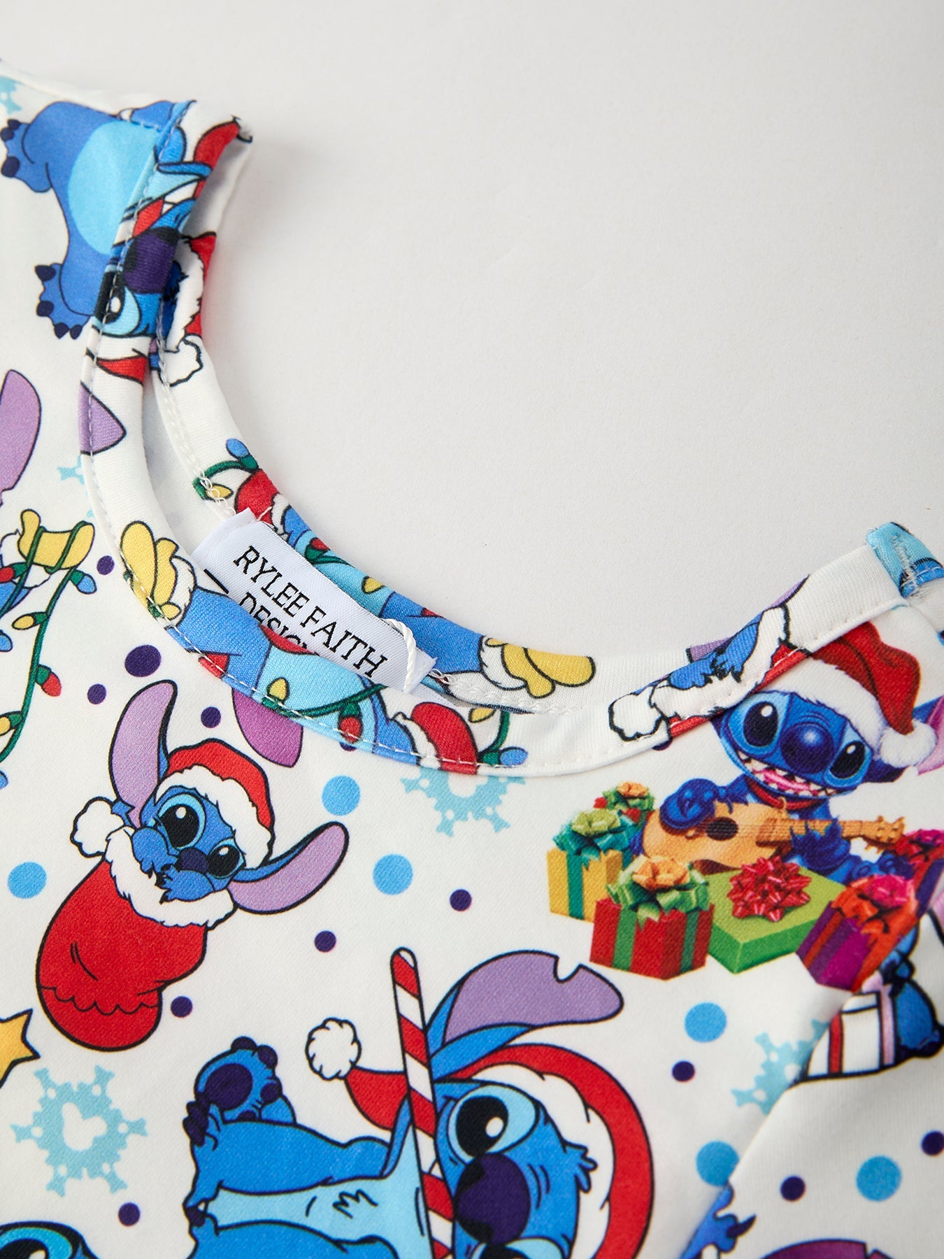 Children's outfit with Christmas-themed design featuring cartoon character on a white background