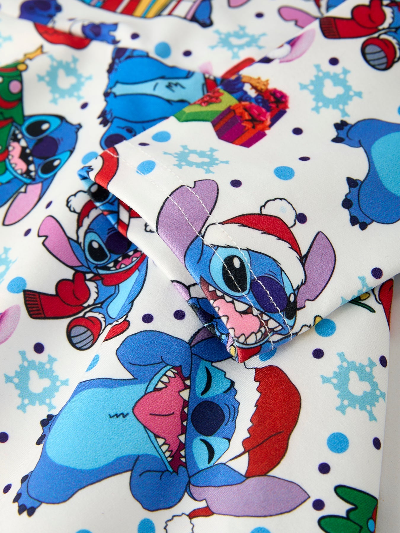 Colorful cartoon character design with snowflakes and festive elements on a white background