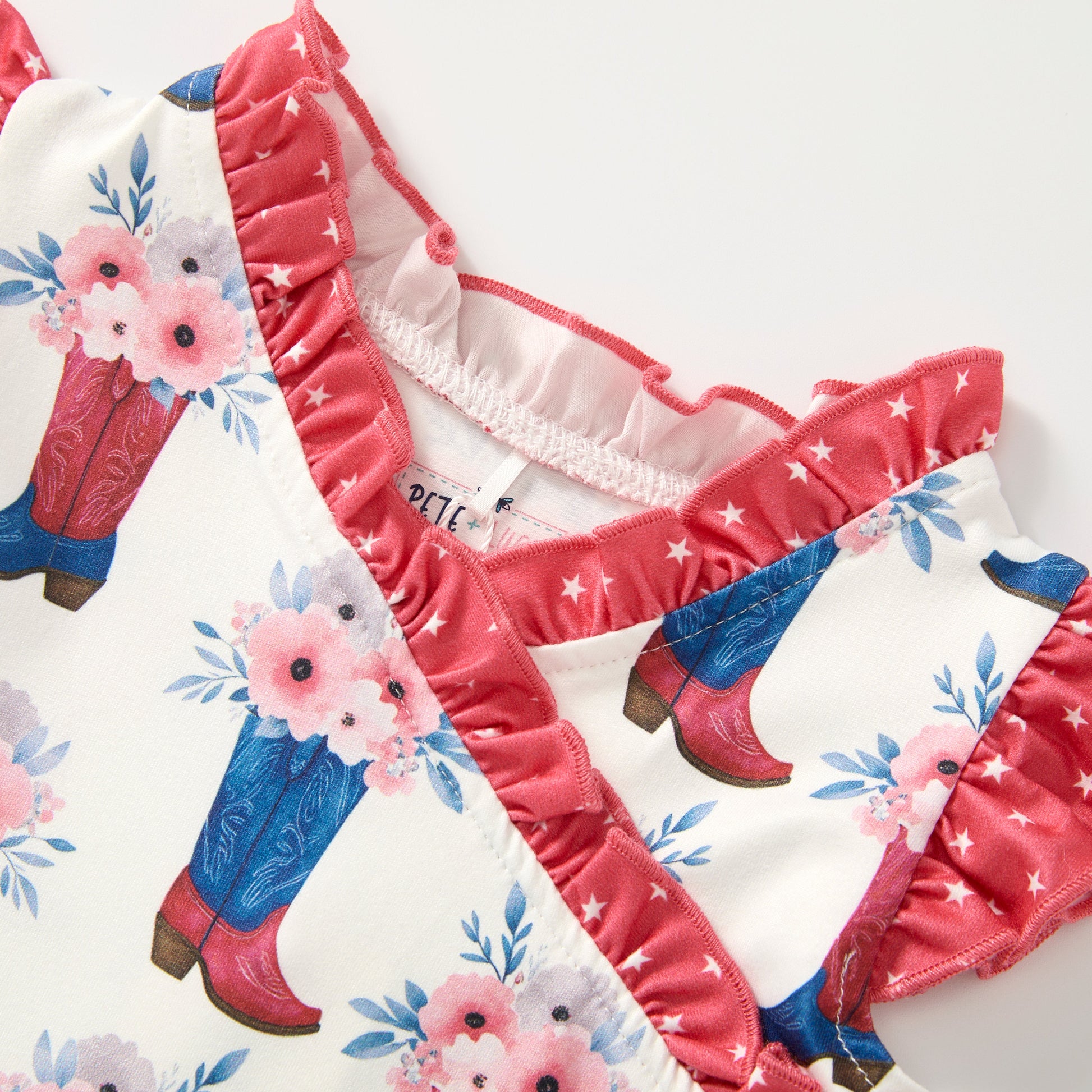 Children's underwear set with floral and boot designs on a white background