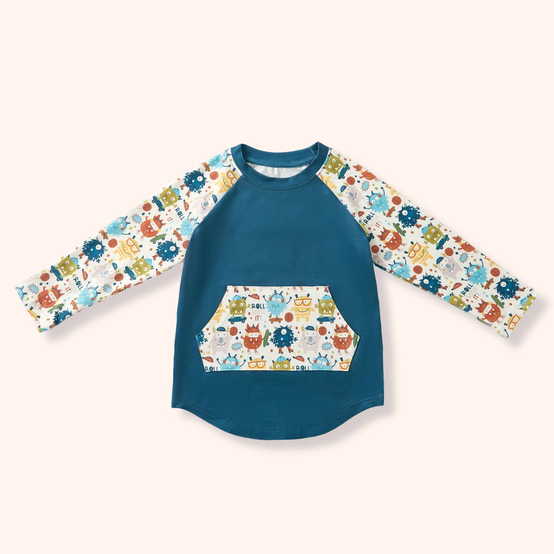 Children's long-sleeve shirt with a colorful & fun monster pattern on a white background