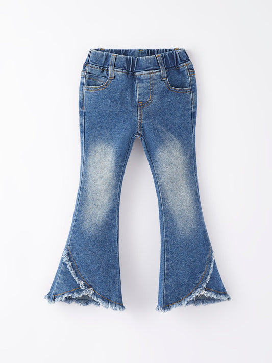 A pair of blue denim bell-bottom pants for girls with a frayed hemline.