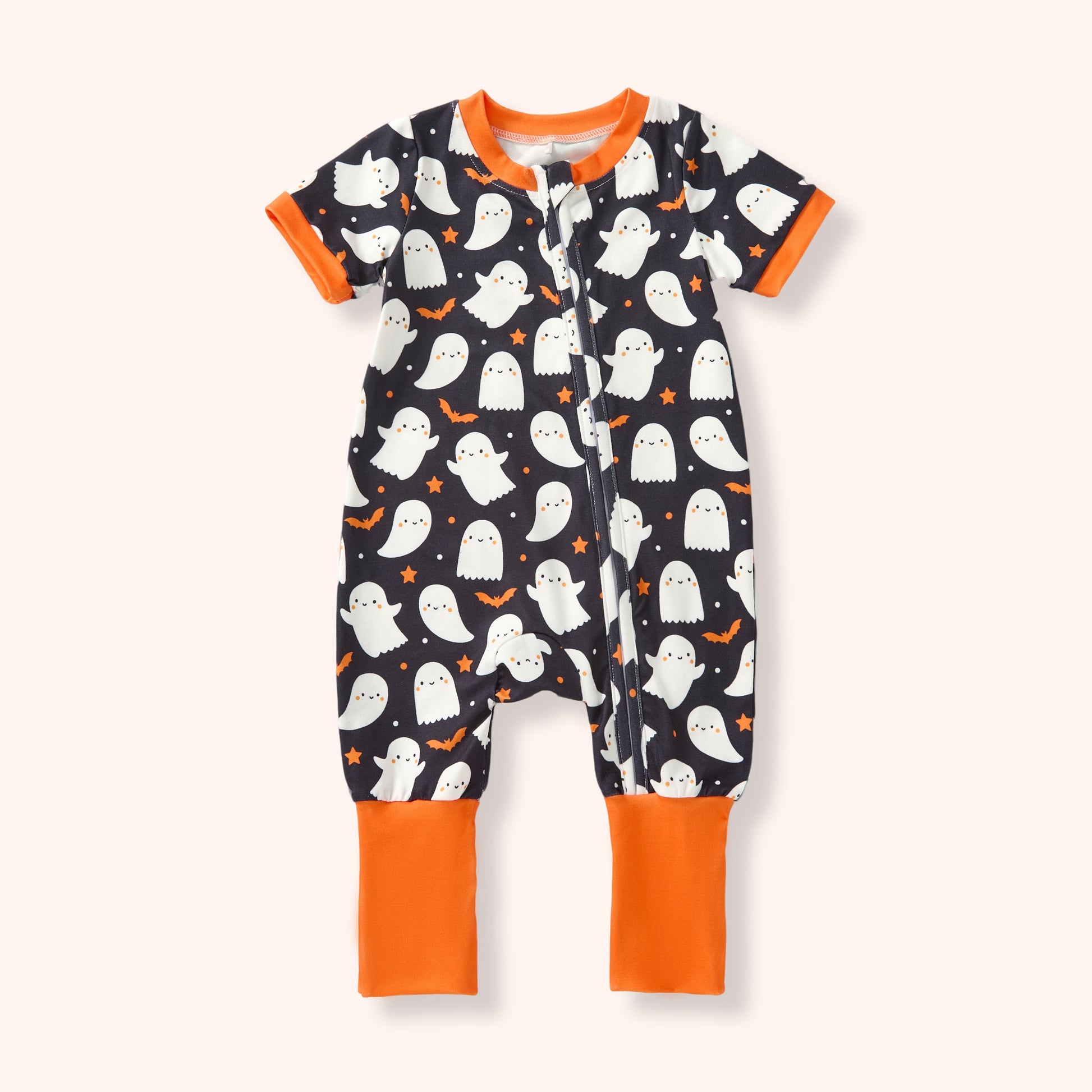 Halloween-themed baby onesie with ghosts and orange accents on a white background