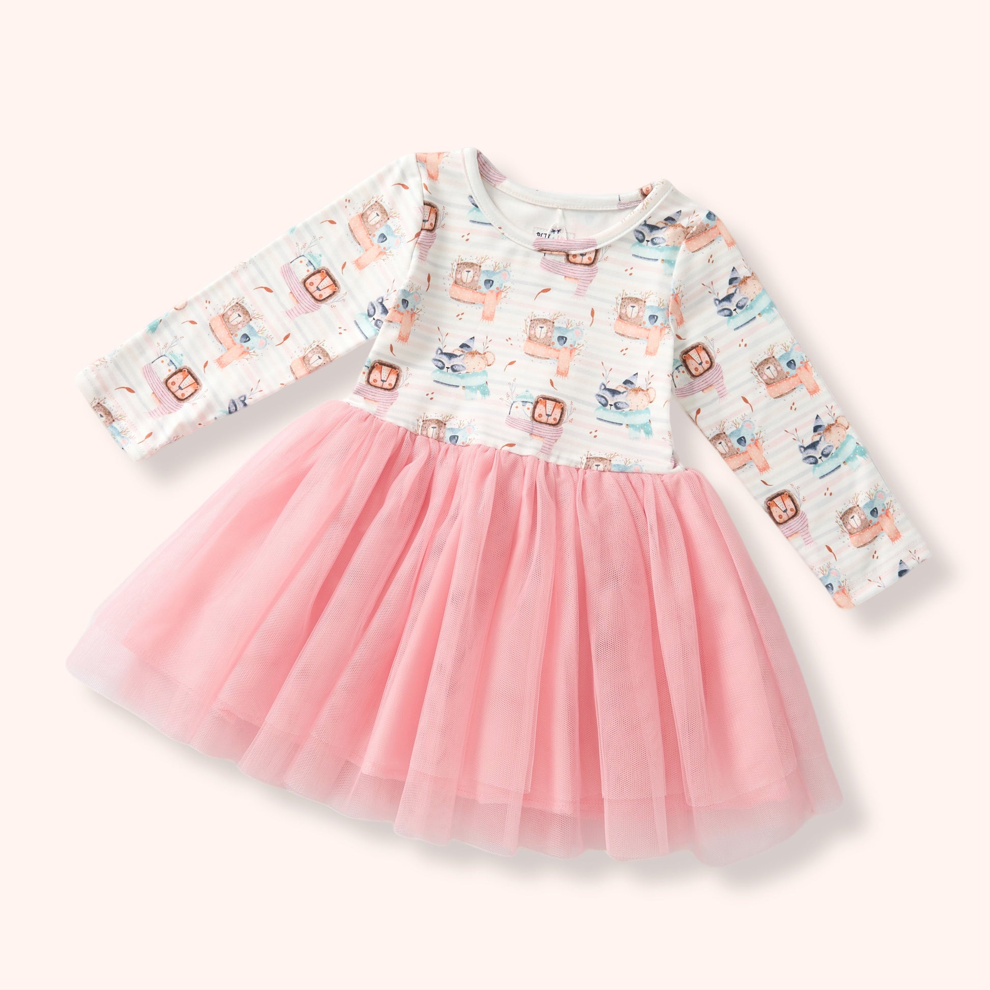 A toddler girl's long-sleeve dress with a white printed bodice featuring cartoon characters and a fluffy pink tulle skirt, shown on a light cream background.