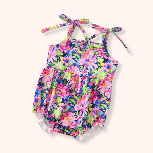 Floral-patterned infant romper on a white background