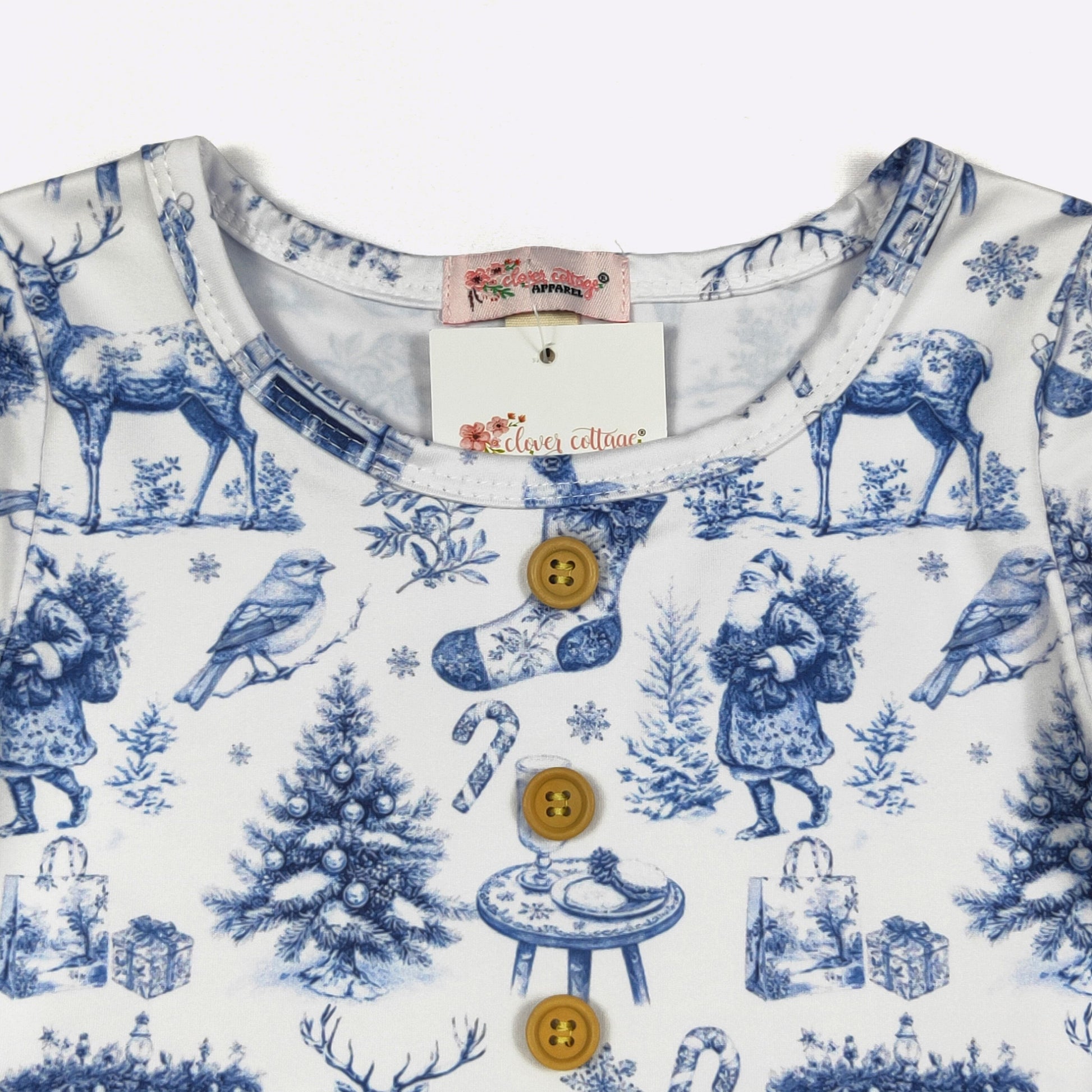 Children's outfit with blue Christmas-themed print on a white background