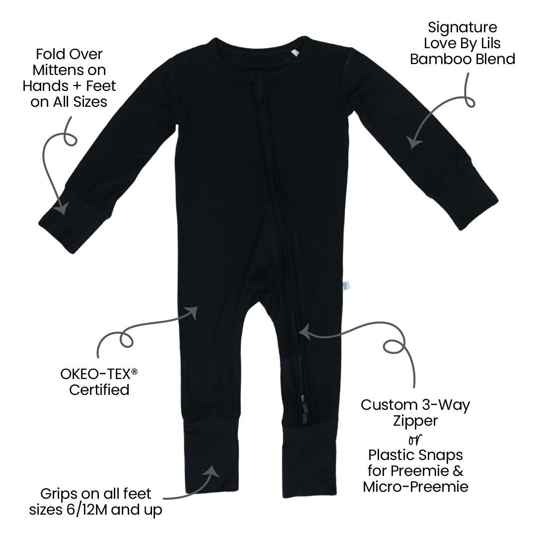 Black baby onesie with features labeled on a white background