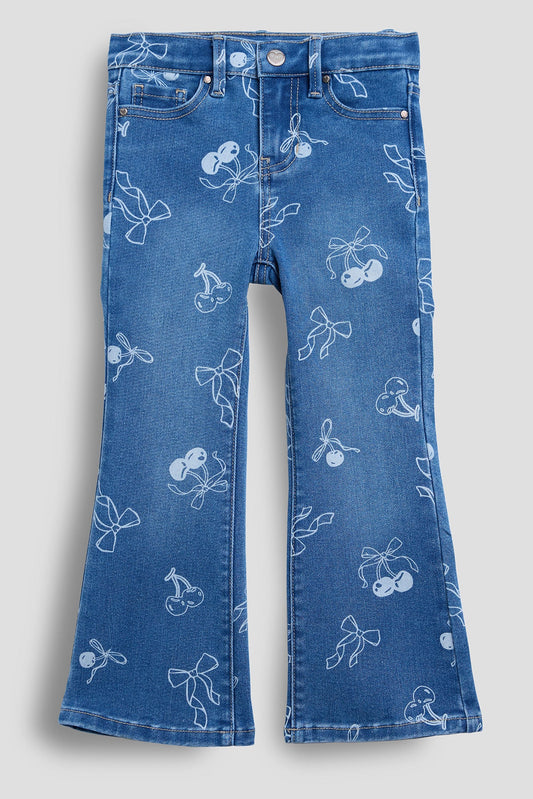 Blue jeans with white floral patterns on a light gray background
