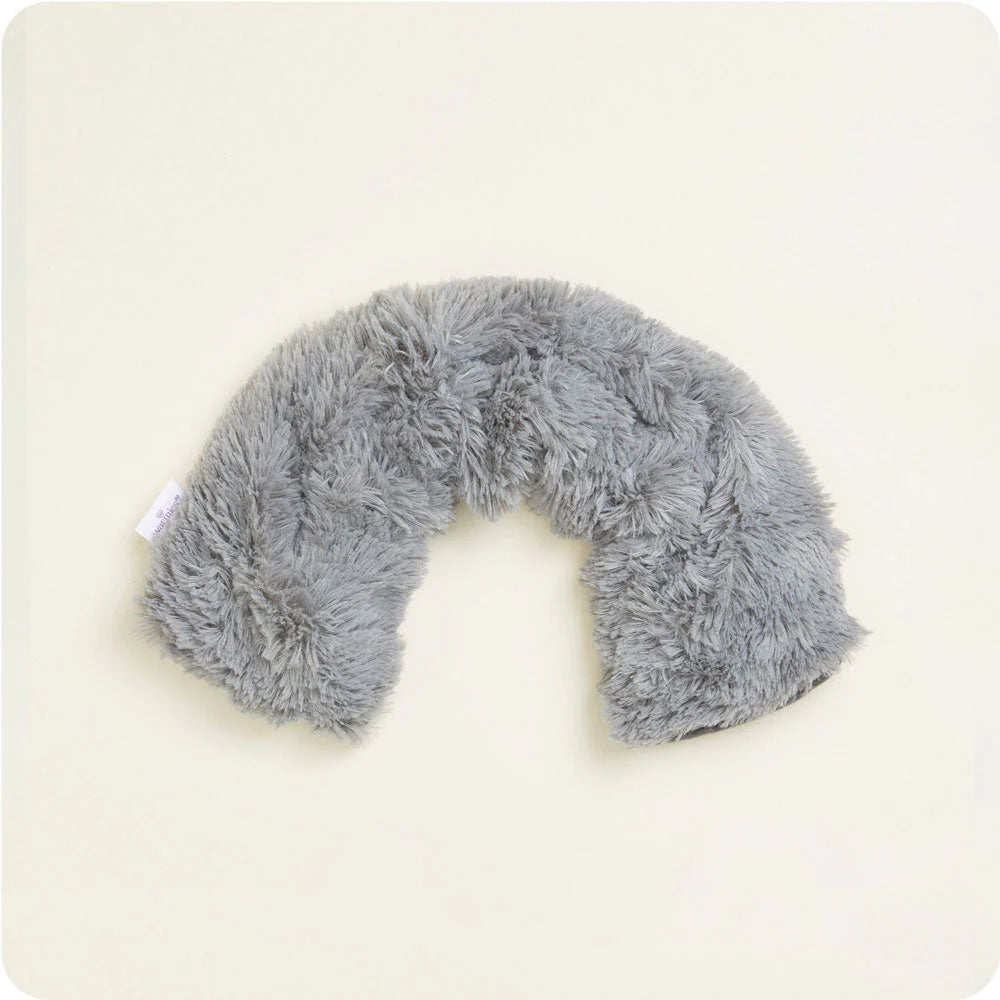 Gray fluffy neck pillow on a white background