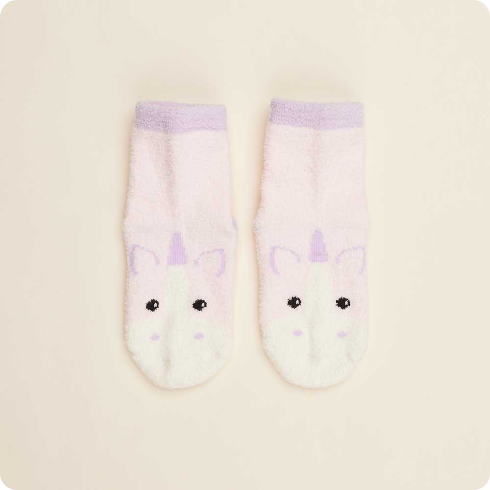 Pair of socks with unicorn design on a beige background