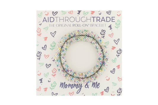 Beaded bracelet packaging with 'Aid Through Trade' branding on a white background