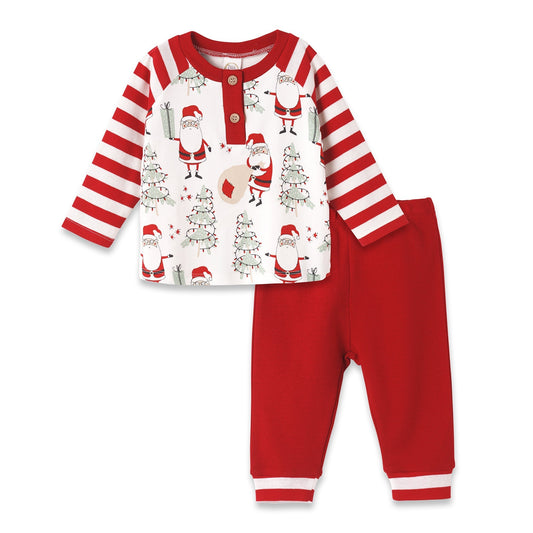 Children's Christmas pajama set with Santa Claus and tree design on a white background
