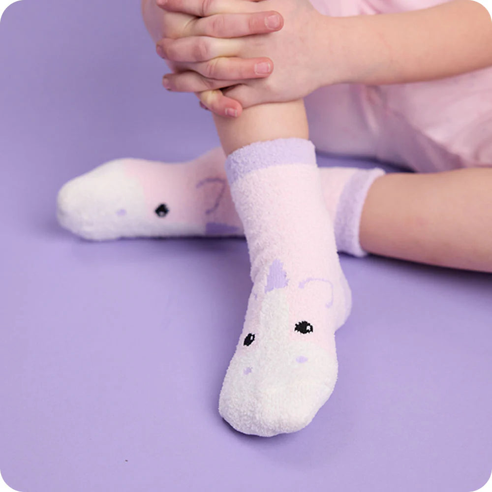 Children's socks with animal faces on a purple background